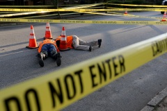 What at first looks like it could be a double murder scene in Midtown is actually two workers inspecting a sinkhole that opened up on Boulevard Place.